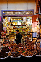 Nuts, dates and sweets for sale on a stall in souk / market, Fes, Morocco, December 2010.