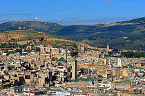 Medina quarter of Fes showing city walls and surrounding hillside. Morocco, December 2010.