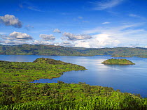View of lake with island, below Virunga Volcanoes NP, Rwanda, Africa, April 2010.