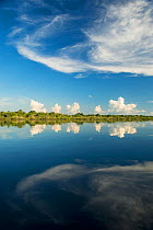 Clouds reflected in the Rio Negro. The Amazon basin, Brazil.