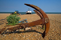 Anchor and fishing boats on the shingle, Aldeburgh, Suffolk, UK