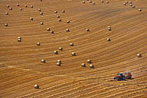 Aerial view of bales of straw in stubble field after harvest, Buckinghamshire, UK, August