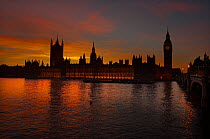 Silhouette of Big Ben clock tower and The Houses of Parliament on the River Thames at sunset, Westminster, London, UK
