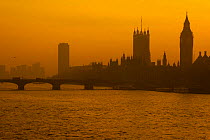 Silhouette of Bigben clock tower and The Houses of Parliament on the River Thames at sunset, Westminster, London, UK