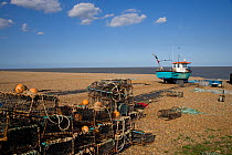 Crab pots and crabbing boat on beach, Southwold, Suffolk, UK, May
