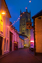 Lights decorating narrow street at Christmas, Cromer, Norfolk, UK