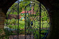 Wrought iron gate into The Spider Garden at Hoveton Hall, Norfolk, UK