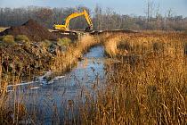 Machinery used to clear a drainage channel that was silting up, marshland management of the Norfolk Broads, Norfolk, UK