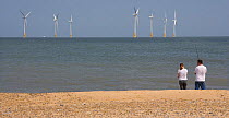 Wind turbines in offshore windfarm off Caister beach, Norfolk, UK