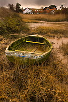 Old dinghy on saltmarshes, Brancaster, Norfolk, UK, March 2009