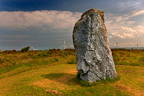 The Longstone standing stone at St Breock Downs with wind turbines in the background, Cornwall, UK, June 2005