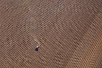 Aerial view of tractor on farmland, Southrepps Norfolk, UK, September 2009