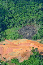 Aerial view of construction of a road in primary forest. French Guyana, 2008.
