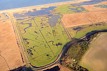 Aerial view of Cley Marshes nature reserve, looking out to sea with Walsey Hills migration watchpoint in the foreground and the East bank to the left, Norfolk, UK, January 2011.