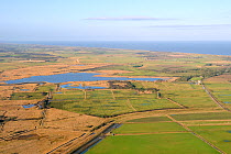 Aerial view of Horsey Mere with Horsey Estate in the foreground and Horsey Mill to the right, and the North Sea in the background, The Broads National Park, Norfolk, UK, January 2011.