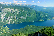 Overview of Lake Bohinj from 1535m at the top of the Vogel cable car lift, with 2864m Mount Triglav, the highest peak in the Julian Alps, in the background, Triglav National Park, Slovenia, July 2010.