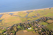 Aerial view of Salthouse village and Salthouse Marshes nature reserve, looking out to sea, north Norfolk, UK, January 2011.