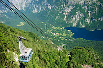 Overview of the Vogel cable car lift on its way up from Ucanc to the 1535m top station, with the north end of Lake Bohinj below and the Julian Alps in the background, Triglav National Park, Slovenia,...