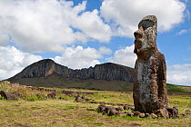 The lone Moai standing aside from the main group at Ahu Tongariki with the quarry at Rano Raraku in the background. Easter Island, October 2009.