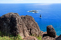 Rock petroglyphs at Orongo with the "Bird Man" islets in the background. Orongo, Easter Island, October 2009.