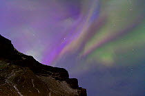 Northern Lights (Aurora Borealis) seen from mountainside. Southern Iceland, Europe, March 2011.