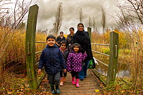 Family walking down path at Conkers, Visitor Centre, The National Forest, Derbyshire, UK, November 2010. 2020VISION Exhibition. 2020VISION Book Plate. Did you know? Since 1995 nearly a quarter of a mi...