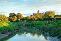 Landscape with river Parrett in foreground and  Burrow Mump in background, with ruined church,  Somerset Levels, Somerset, UK, September 2007