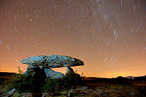 Dolmen d'Eyna at night, with a long exposure capturing star trails. Eyne, Pyrenees, France, September 2010.