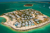 Small island with luxury houses and swimming pools. Florida Keys, Florida, USA, April 2006.