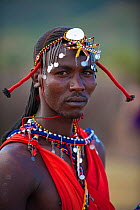 Portrait of a Masai tribe member in ceremonial dress. Masai Mara Special reserve, Kenya, Africa.