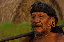 Portrait of a Huaorani man with blowgun over his shoulder. Bameno Community, Yasuni National Park, Ecuador, May 2007. Model release B#1.