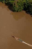 Motor canoe on the Aguarico River in Cuyabeno Reserve seen from the air. Ecuador, June 2007.