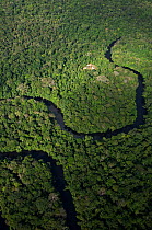 Cofan houses and meandering river in Cuyabeno Reserve seen from the air. Ecuador, June 2007.