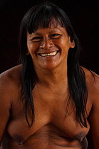 Portrait of a smiling Huaorani woman. Bameno Community, Yasuni National Park, Ecuador, June 2007. Model release #CO27