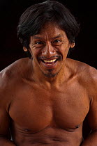 Portrait of a smiling Huaorani man. Bameno Community, Yasuni National Park, Ecuador, June 2007. Model release #CO25