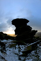 Gritstone boulders in snow showing erosion caused by weathering, Ladybower Reservoir, Peak District NP, Derbyshire, UK, December 2009
