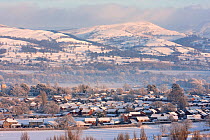 Town and countryside in exteme winter weather Denbigh with Clwydian range in the background, Denbighshire, North Wales, UK, December 2010