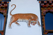 A stylised image of a tiger painted on the pillar of a building. Bhutan, May 2008.