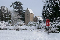 Kinnersley Church in the snow, featuring 13th century tower with saddle-back-roof. Herefordshire, England, December 2010.