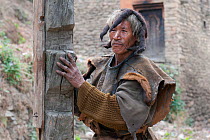 Monpa man wearing a typical head dress made from Yak hair. Arunachal Pradesh, India, February 2011.