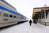 Man on platform and train at the station of Churchill, Manitoba, Canada, March 2011.