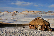A yurt of a Kyrgyz shepherd family on the steppe. Naryn National Park, Kyrgyzstan, Central Asia, November 2009.