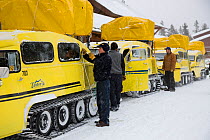 Snow coaches at Snow Lodge. Upper Geyser Basin, Yellowstone National Park, Wyoming, January 2008.