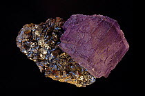 Fluorite (CaF2) (calcium fluoride) on Sphalerite (ZnS) (zinc sulfide).Fluorite is a source of fluorine-used in the manufacture of milk glass-as a flux for the steel industry and in refining of aluminu...