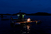 Floating cages for Coral trout (Plectropomus leopardus) with solar powered light for night security to protect from poachers, Live Reef Fish Trade, Palawan, Philippines, May 2009.