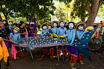 Local children with whale shark model at the Butanding Whale Shark Festival, Donsol, Philippines, April 2010.