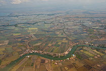Aerial view of rice paddies and fish ponds in Makassar with river tributaries, South Sulawesi, Indonesia, Nvember 2009.