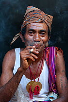 Portrait of East Timorese man in traditional clothing, Maubara, East Timor, August 2010.