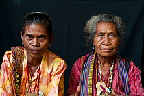 Portrait of two East Timorese women in traditional clothing, Maubara, East Timor, August 2010.