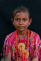 Portrait of young East Timorese girl in traditional clothing, Maubara, East Timor, August 2010.